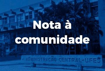 Cartaz com a inscrição "Nota à comunidade" e uma foto da reitoria ao fundo, em tons de azul